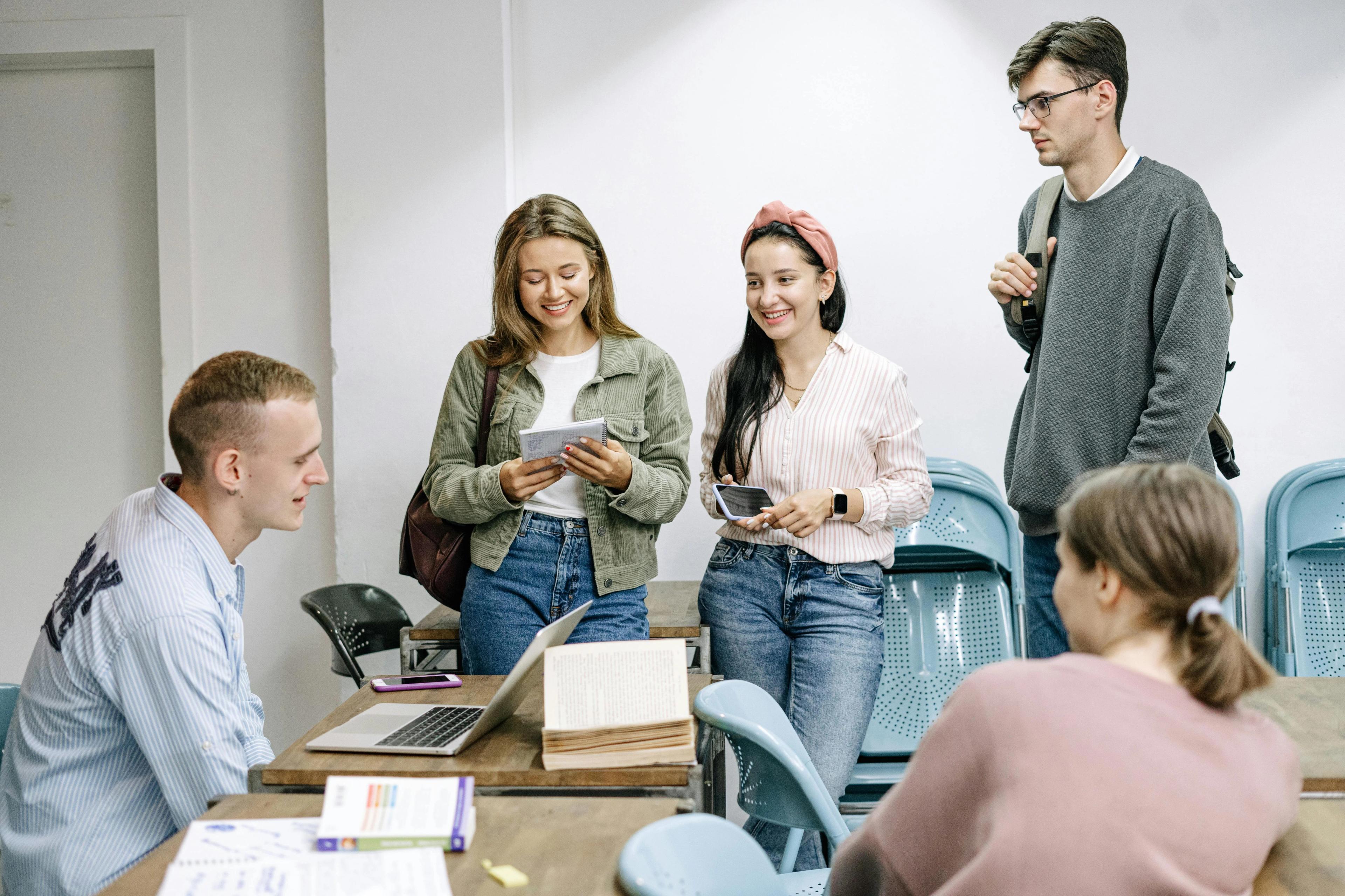 Teacher reviewing exams with his students